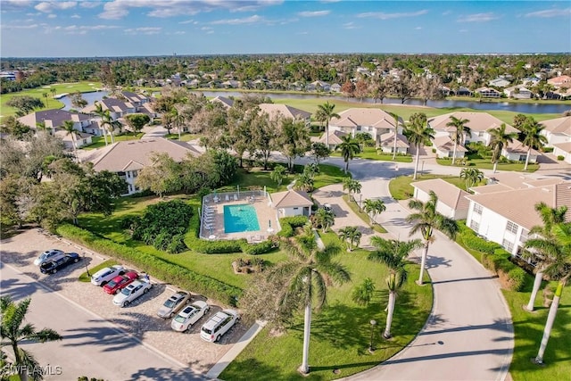 birds eye view of property with a residential view and a water view