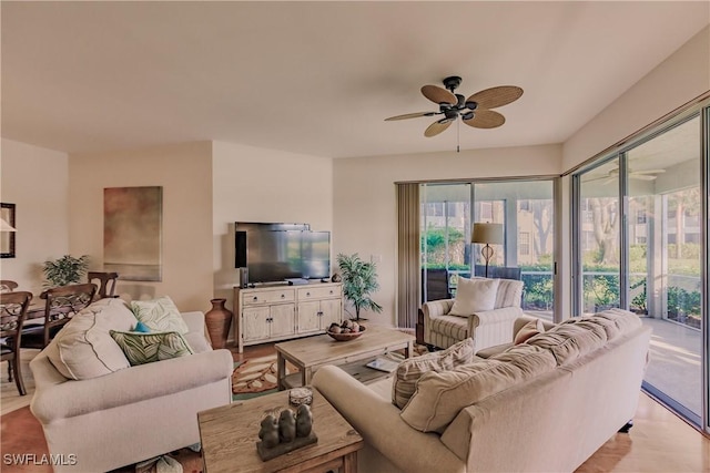living room with light wood-style floors and ceiling fan