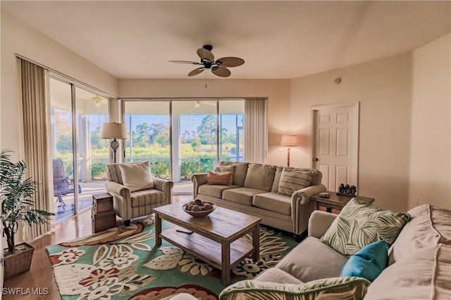 living room featuring wood finished floors and ceiling fan