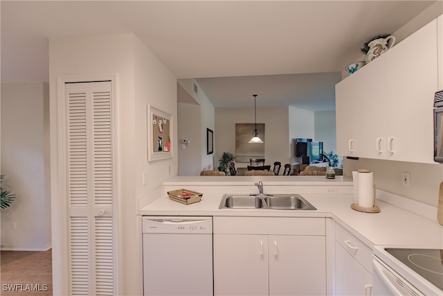 kitchen with light tile patterned floors, white cabinetry, pendant lighting, sink, and white appliances