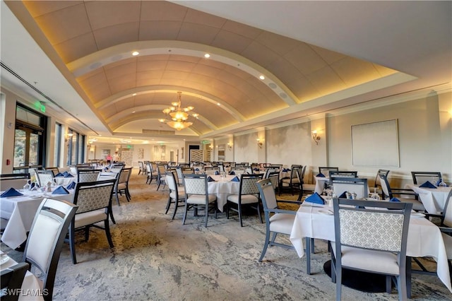 dining space featuring recessed lighting, vaulted ceiling, and a notable chandelier