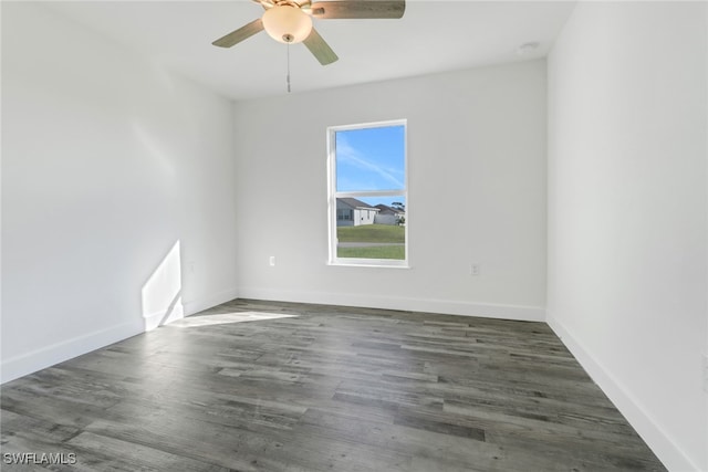 empty room featuring dark hardwood / wood-style floors and ceiling fan