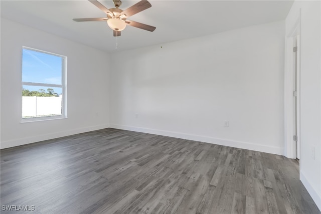 spare room with hardwood / wood-style flooring and ceiling fan