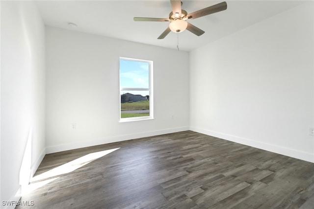 spare room featuring ceiling fan and dark hardwood / wood-style flooring