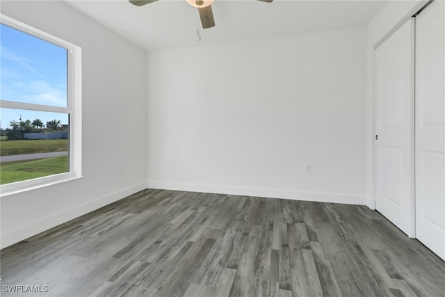 unfurnished room featuring ceiling fan and hardwood / wood-style floors