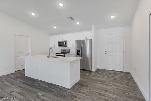 kitchen featuring white cabinets, an island with sink, appliances with stainless steel finishes, and dark hardwood / wood-style floors