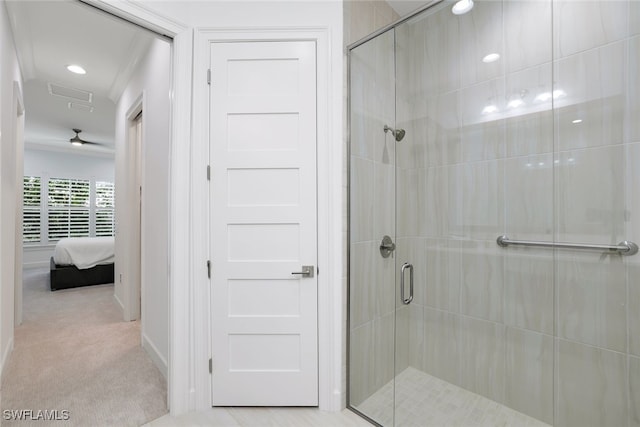 bathroom with a shower with door