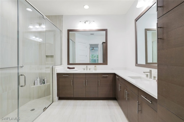 bathroom with walk in shower and vanity