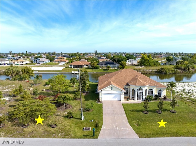 birds eye view of property with a water view