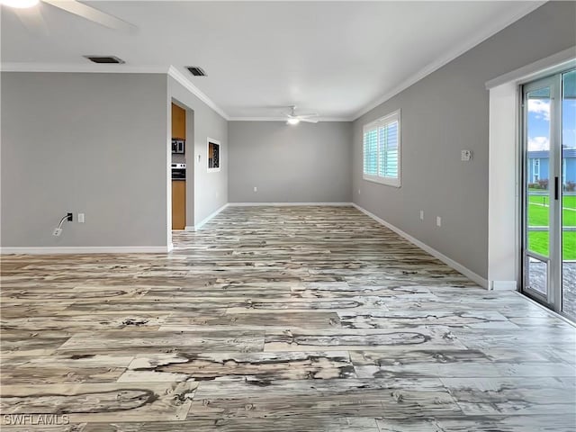 empty room featuring light wood-type flooring, ceiling fan, and crown molding