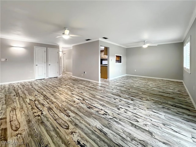 interior space featuring ceiling fan, wood-type flooring, and ornamental molding