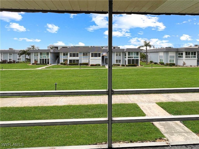 view of home's community with a lawn