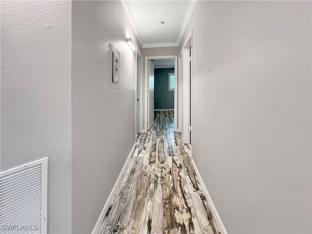 hall with crown molding and hardwood / wood-style flooring