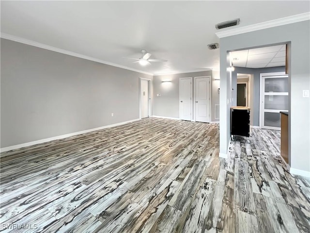 unfurnished bedroom with ceiling fan, wood-type flooring, and ornamental molding