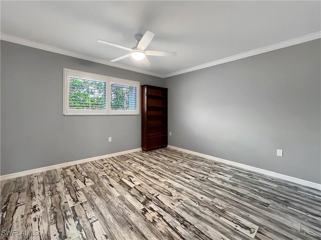 unfurnished room with ceiling fan, ornamental molding, and hardwood / wood-style flooring