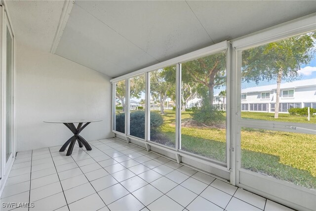 unfurnished sunroom featuring a wealth of natural light