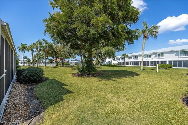 18038 San Carlos Blvd Unit 113, Fort Myers Beach, FL 33931 - view of grassy yard