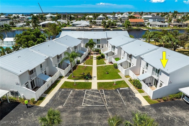 birds eye view of property featuring a water view