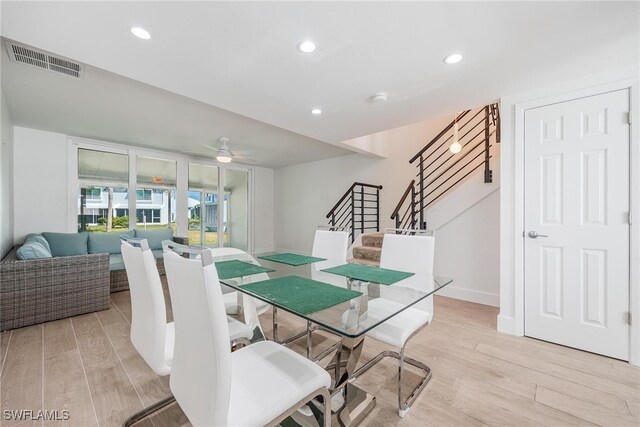 dining room with light hardwood / wood-style flooring and ceiling fan