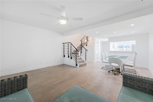 interior space with ceiling fan and light hardwood / wood-style floors