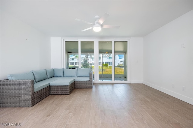 unfurnished living room with light hardwood / wood-style floors and ceiling fan