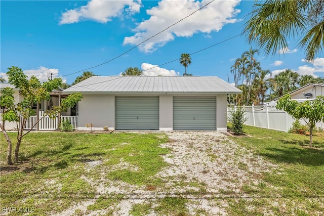 garage featuring a yard