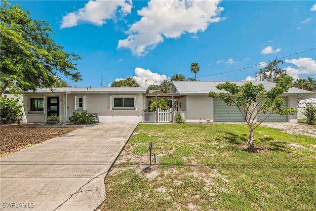 single story home with a front lawn and covered porch