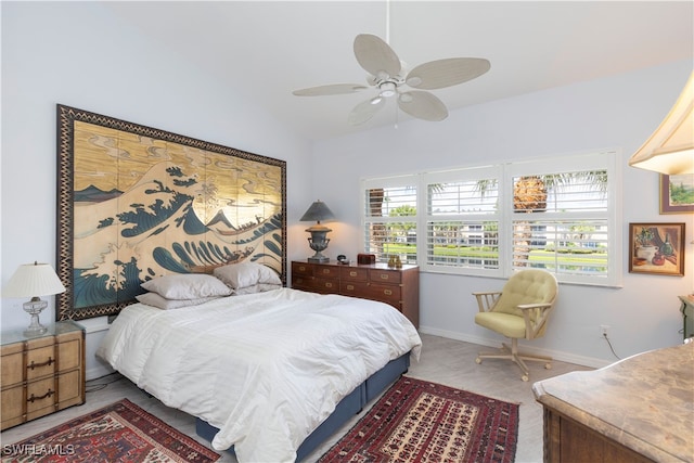 carpeted bedroom featuring ceiling fan and lofted ceiling