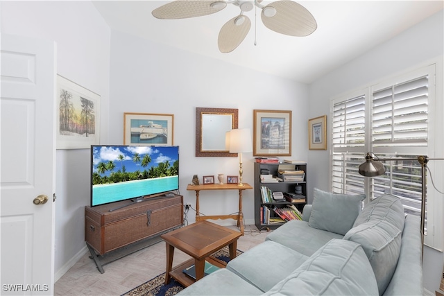 living room with vaulted ceiling, light hardwood / wood-style floors, and ceiling fan