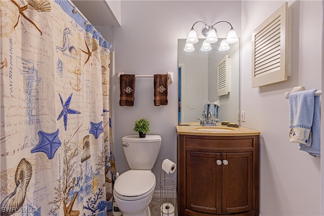 bathroom featuring vanity, a shower with shower curtain, and toilet