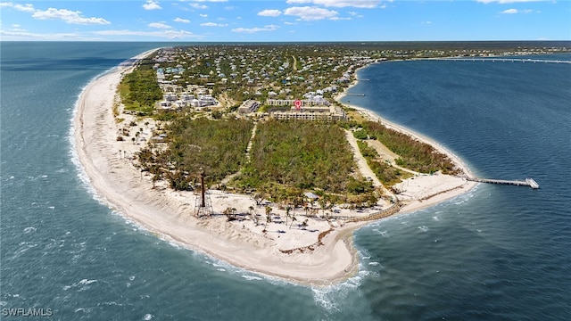 drone / aerial view with a beach view and a water view