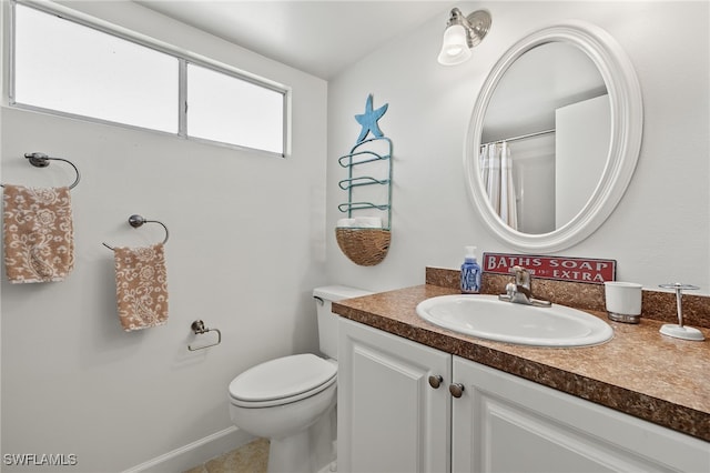 bathroom featuring toilet and vanity