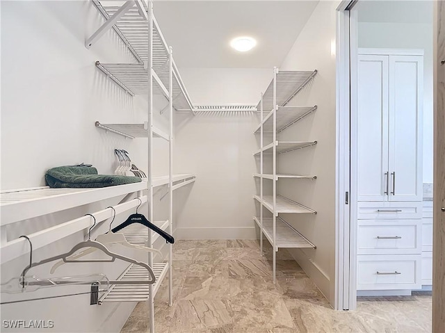 9345 Dimmick Dr, Sanibel, FL 33957 - walk in closet with marble finish floor