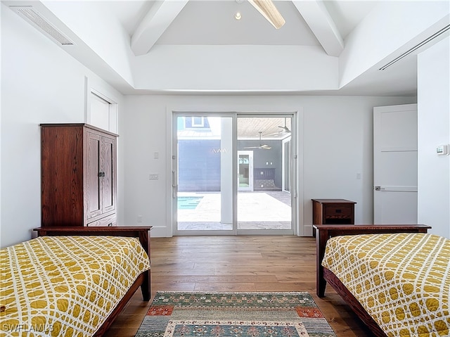 bedroom with wood-type flooring, ceiling fan, beamed ceiling, and access to exterior