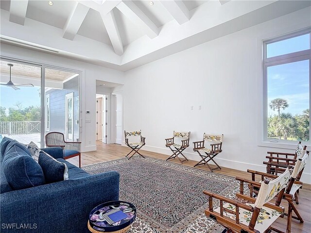 9345 Dimmick Dr, Sanibel, FL 33957 - living room featuring baseboards, wood finished floors, a healthy amount of sunlight, and beam ceiling