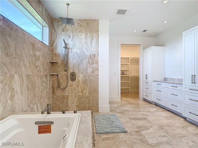 9345 Dimmick Dr, Sanibel, FL 33957 - full bathroom featuring visible vents, walk in shower, a walk in closet, a tub, and recessed lighting