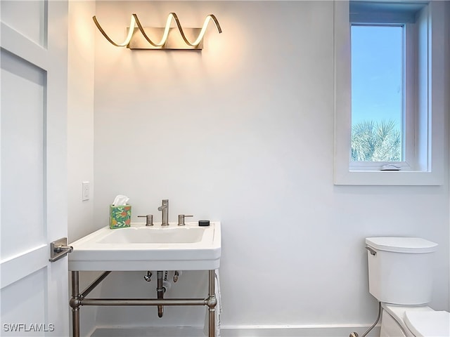 bathroom with toilet and sink