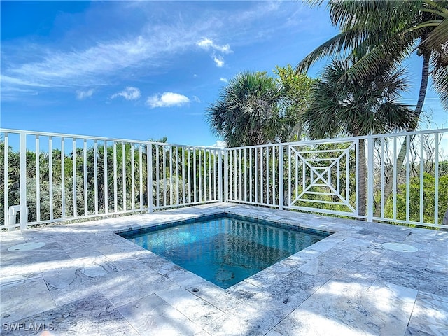 view of pool featuring a patio area and a hot tub