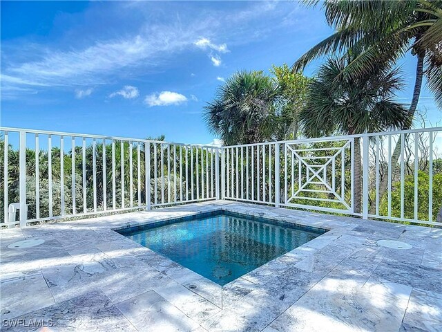 9345 Dimmick Dr, Sanibel, FL 33957 - view of swimming pool featuring a fenced backyard and a pool