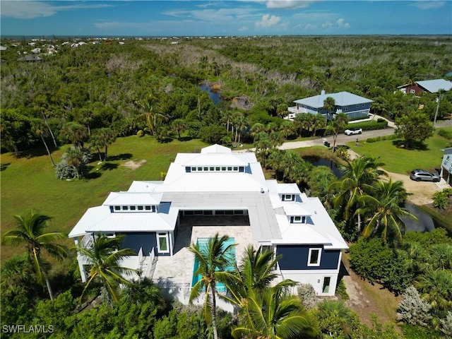 9345 Dimmick Dr, Sanibel, FL 33957 - drone / aerial view with a forest view and a water view