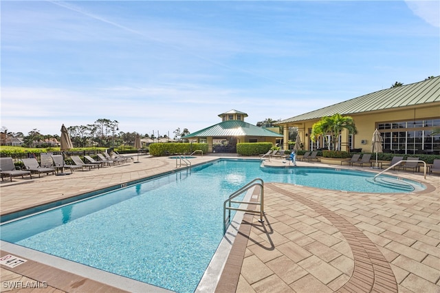 view of swimming pool featuring a gazebo and a patio area