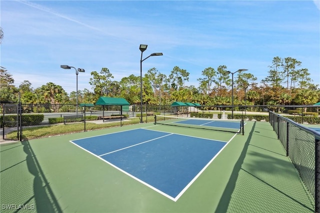 view of sport court with fence
