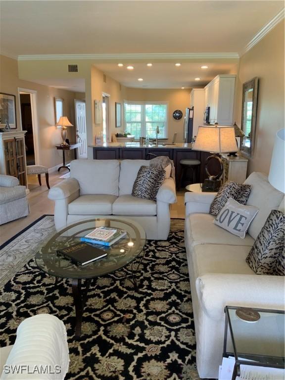 living room featuring ornamental molding