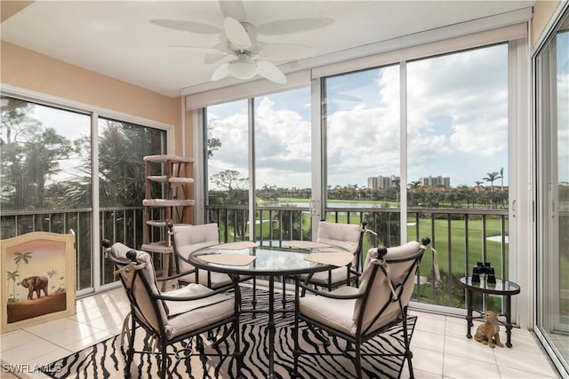 sunroom with ceiling fan and a healthy amount of sunlight