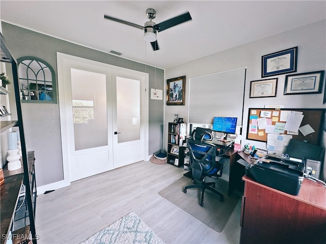 office area featuring french doors, light hardwood / wood-style floors, and ceiling fan