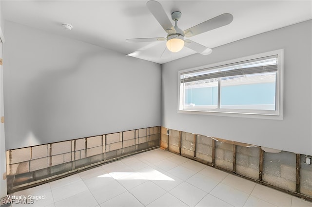 spare room with ceiling fan