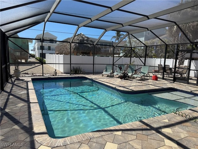 view of pool with a lanai and a patio area