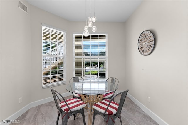 dining room with a chandelier