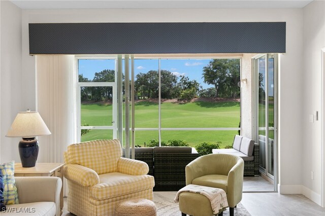 sunroom / solarium featuring a healthy amount of sunlight