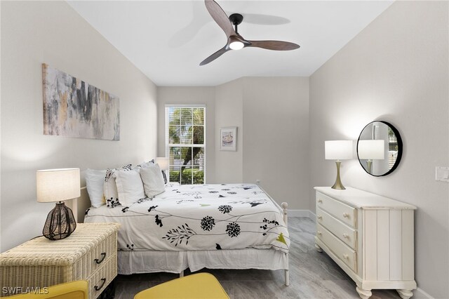 bedroom featuring ceiling fan and light hardwood / wood-style flooring